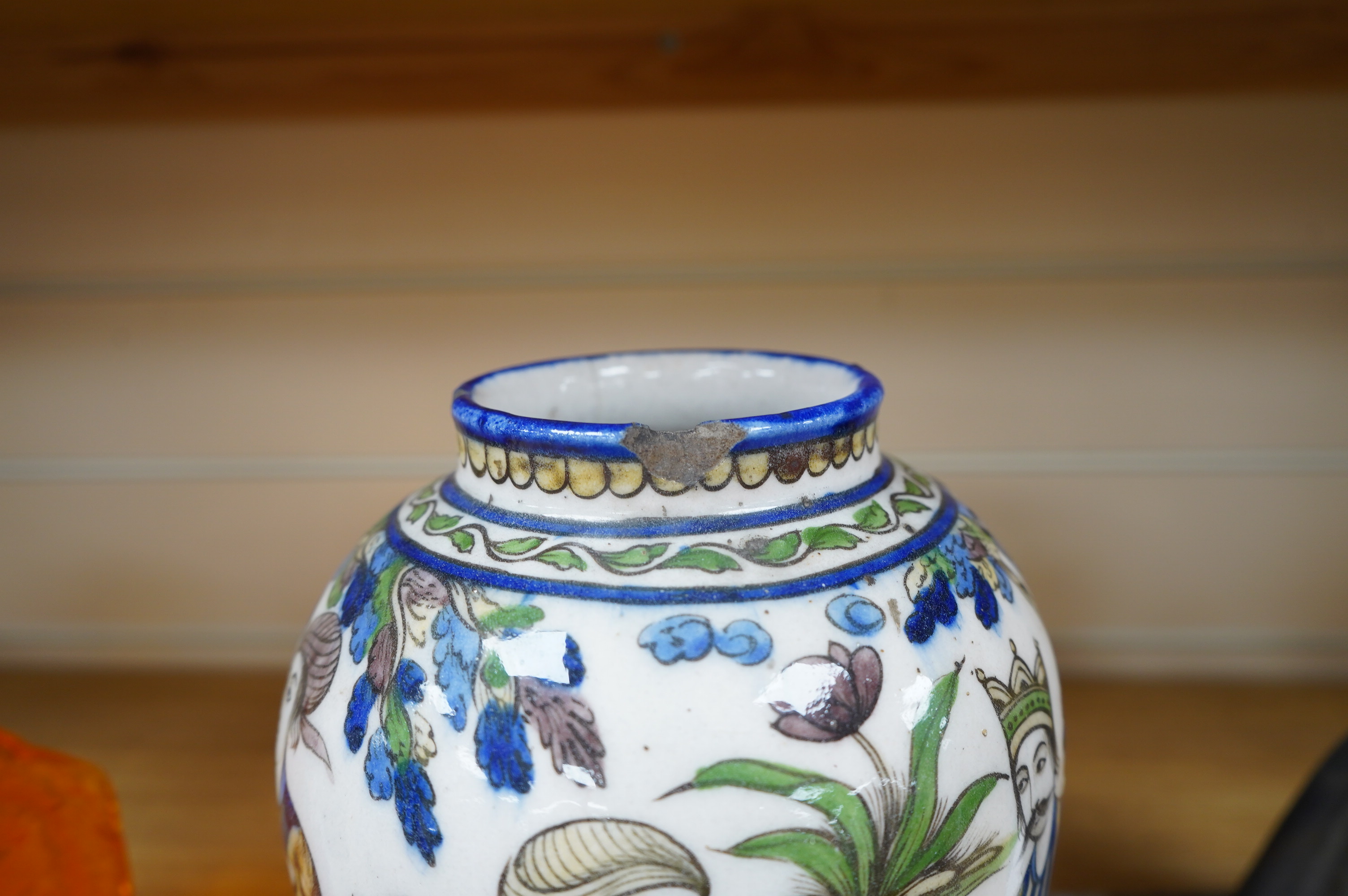 A Persian fritware vase, Qajar dynasty, 22cm. Condition - poor to fair